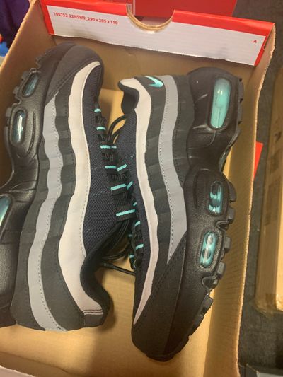 black and grey sneakers with teal accents