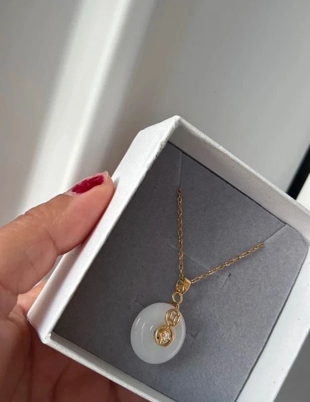 Gold Chain Necklace With White Circular Pendant image 2