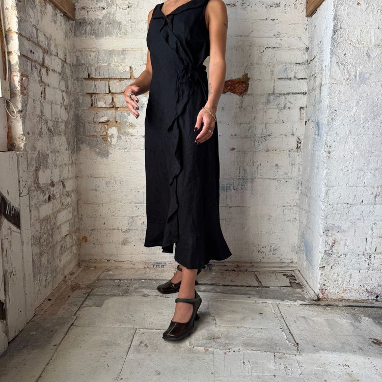 black sleeveless wrap dress