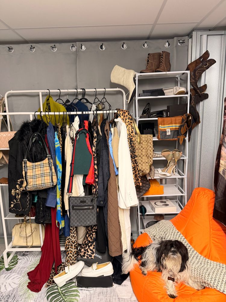 Clothing Rack With Assorted Bags, Shoes, And Clothes