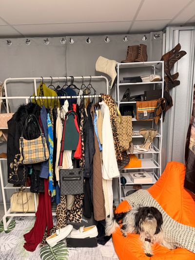 Clothing Rack With Assorted Bags, Shoes, And Clothes