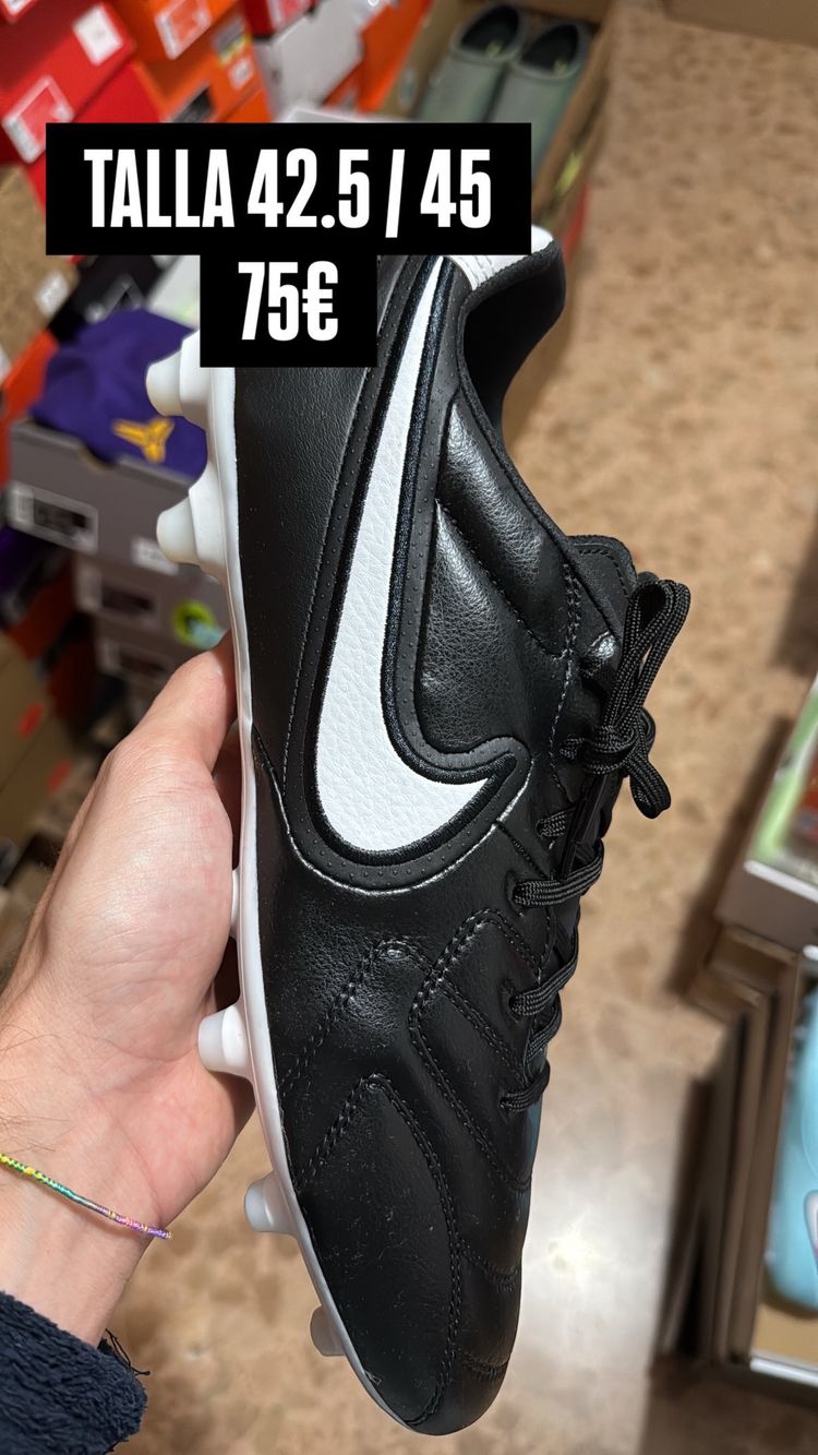 Black Football Cleats With White Swoosh Logo
