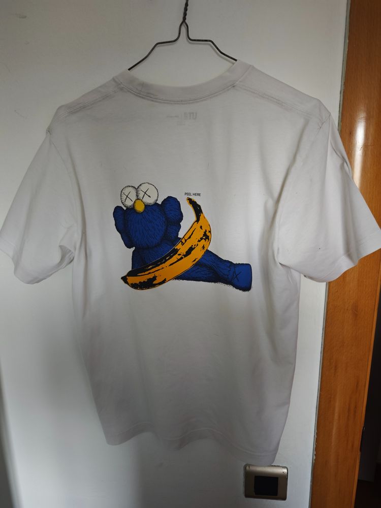 Character white graphic t-shirt with blue character and banana print product image
