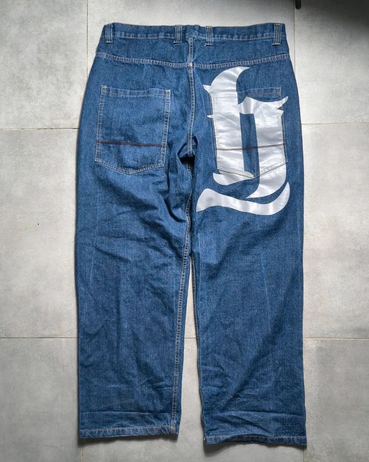 Blue Denim Jeans With Large White Graphic On Back Pocket