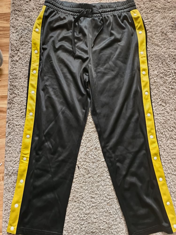 Black Track Pants With Yellow Side Stripes And Snap Buttons
