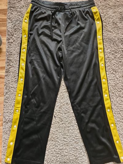Black Track Pants With Yellow Side Stripes And Snap Buttons