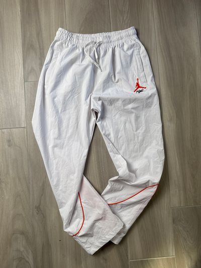 White Track Pants With Red Logo