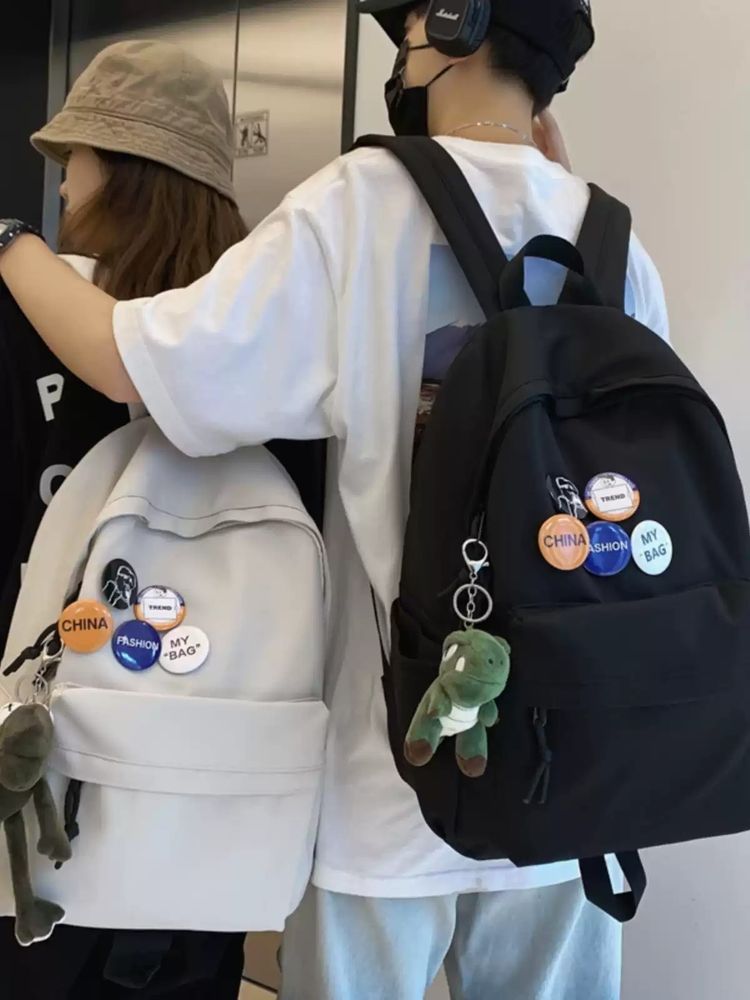 Black Backpack With Pins And Plush Keychain image 2