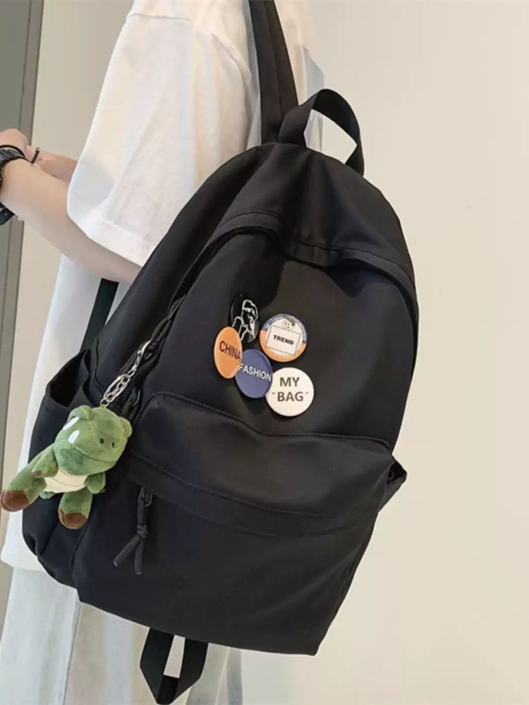 Black Backpack With Pins And Plush Keychain image 1