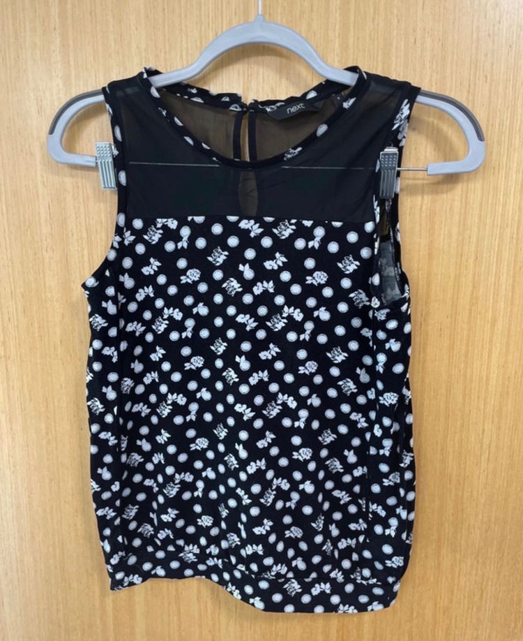 Black Sleeveless Top With White Polka Dots