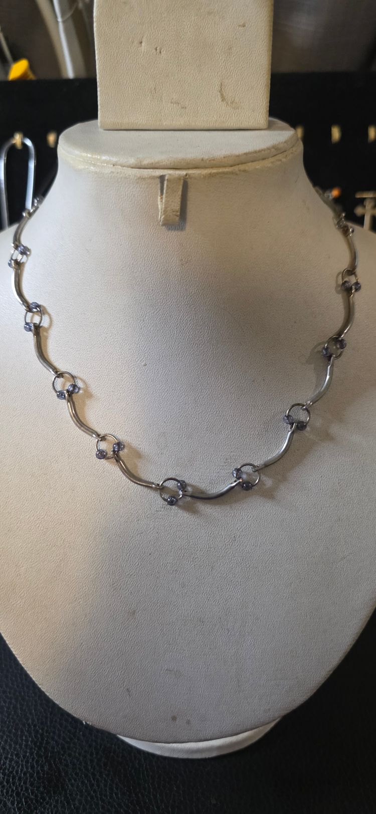 Silver Necklace With Linked Circular And Curved Elements