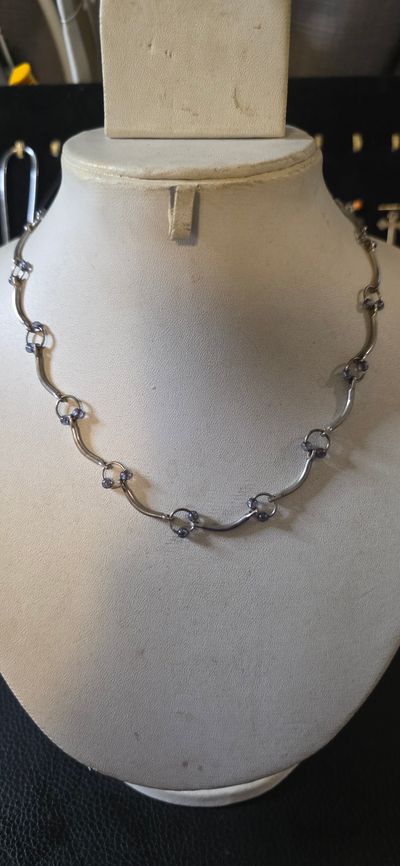Silver Necklace With Linked Circular And Curved Elements