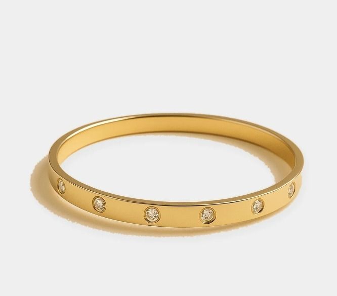 Gold Bangle Bracelet With Embedded Stones