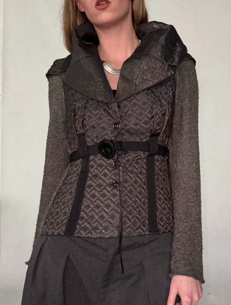 quilted jacket with knit sleeves and belt