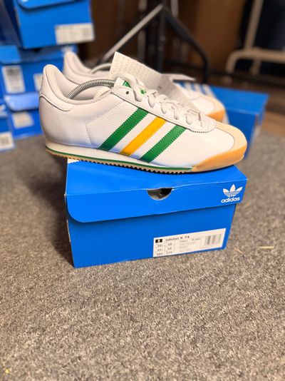 Adidas White Sneakers With Green And Yellow Stripes