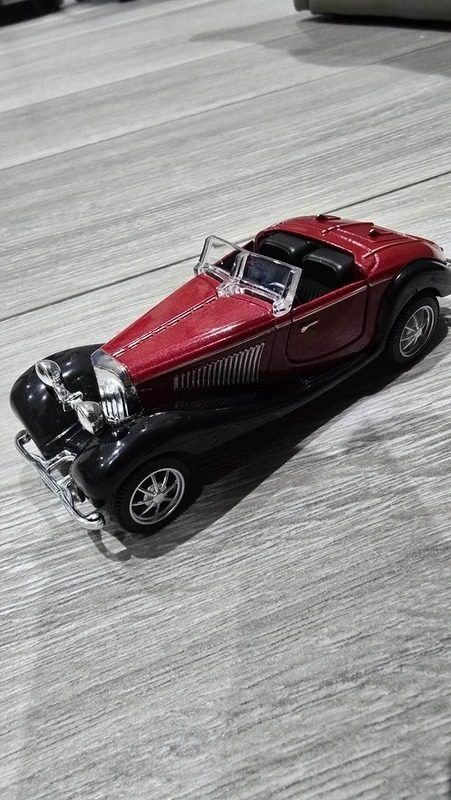 Red And Black Toy Car Model image 2