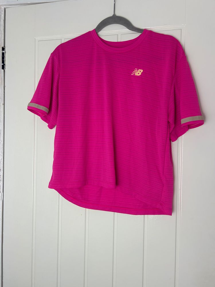 New Balance pink short sleeve shirt