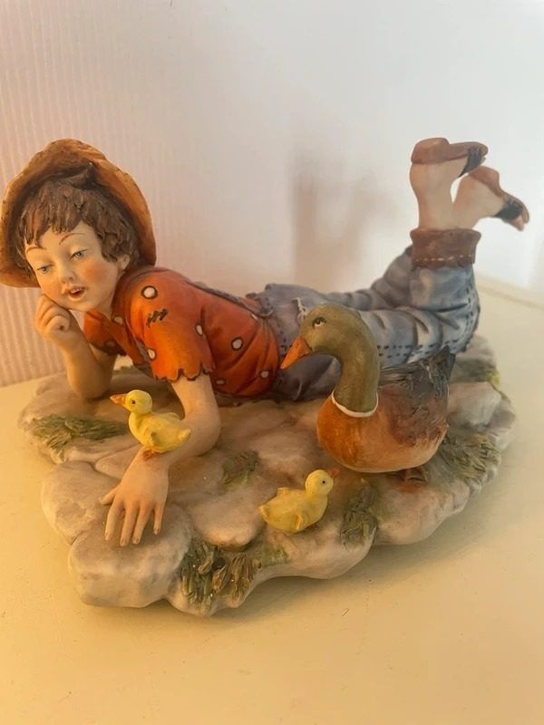 Figurine Of Boy With Duck And Ducklings image 1