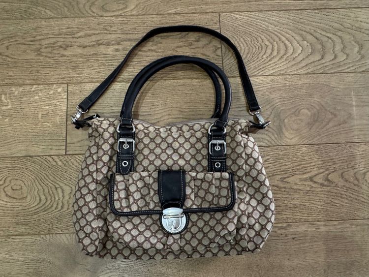 Brown Patterned Handbag With Black Handles And Strap
