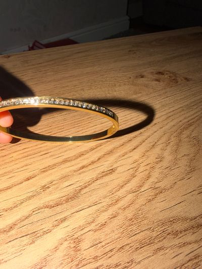 Gold-Tone Bangle Bracelet With Clear Stones