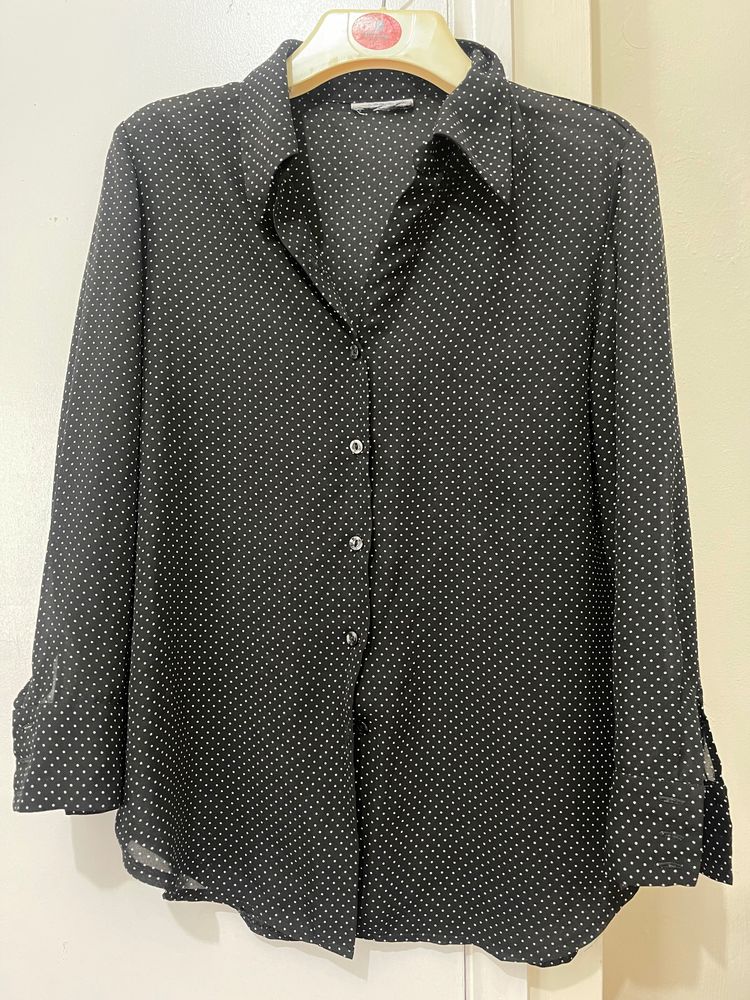 black polka dot shirt