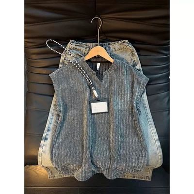 Grey Knitted Sleeveless Sweater Vest And Light Blue Jeans