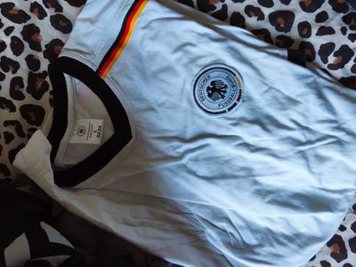 White Sports Jersey With Black Collar And Emblem