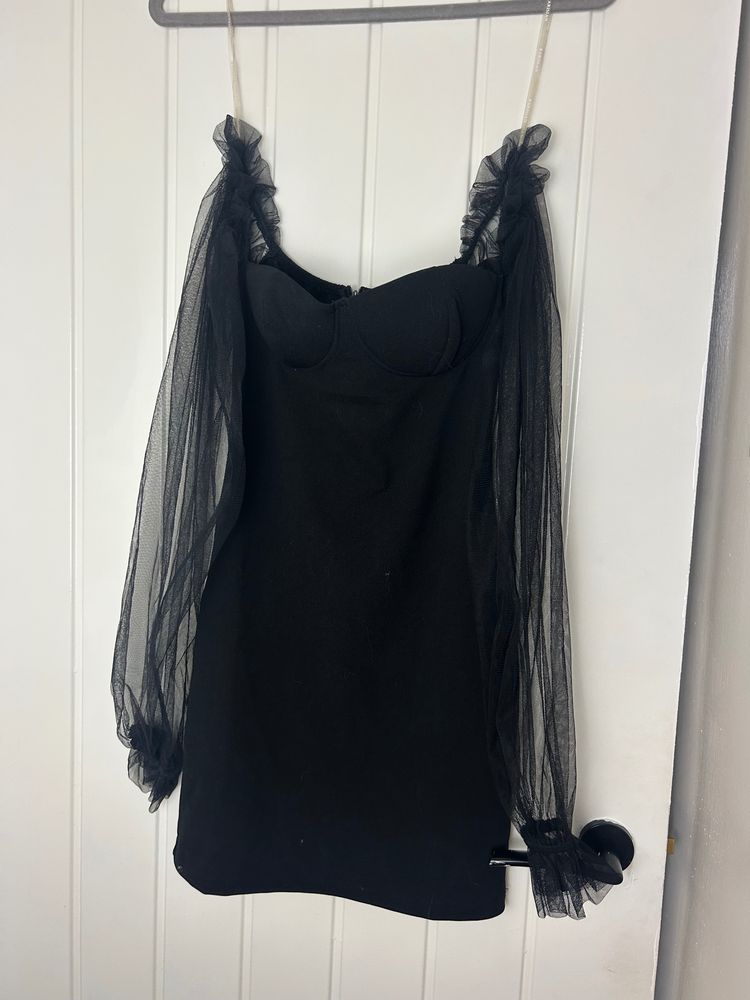 black dress with sheer puff sleeves
