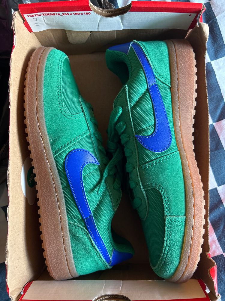 Green Sneakers With Blue Swoosh