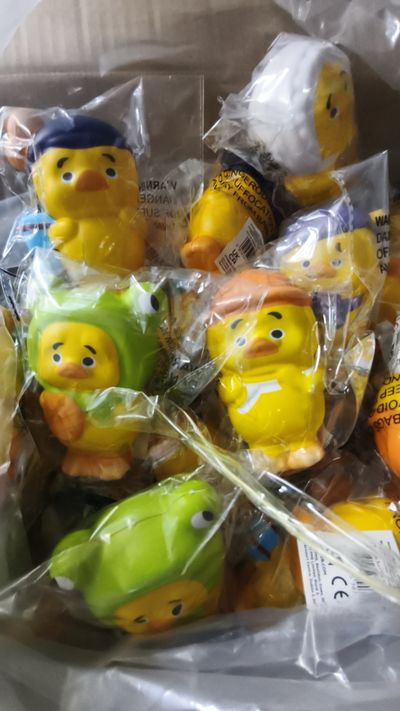 Yellow Duck Figurines In Various Costumes
