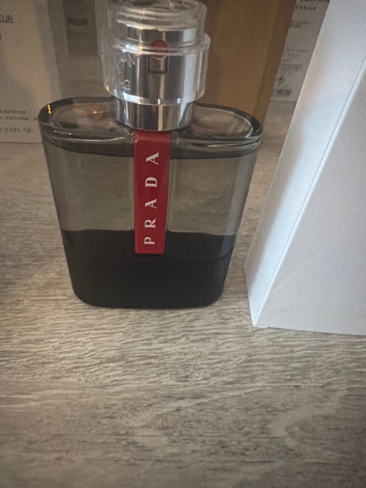 Prada Black And Clear Bottle With Red Label image 1