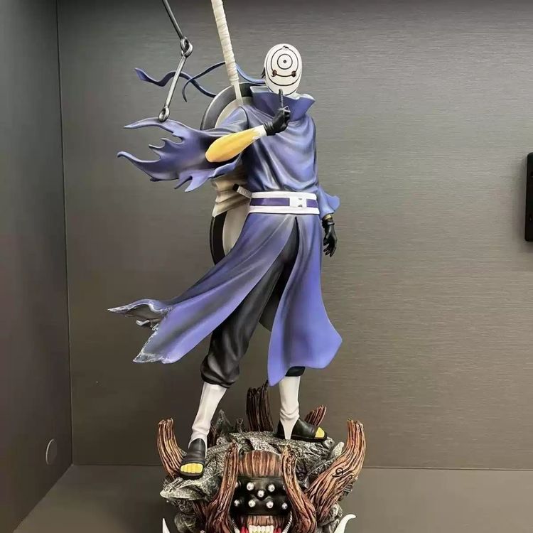 Anime Character Figurine With Purple Cloak And Sword image 1