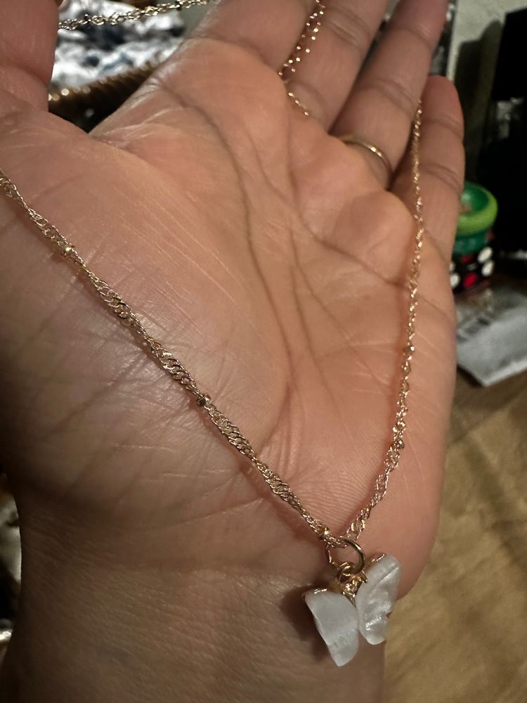 Set Of Gold-Tone Layered Necklaces With Heart, Butterfly, And Pearl Details 5