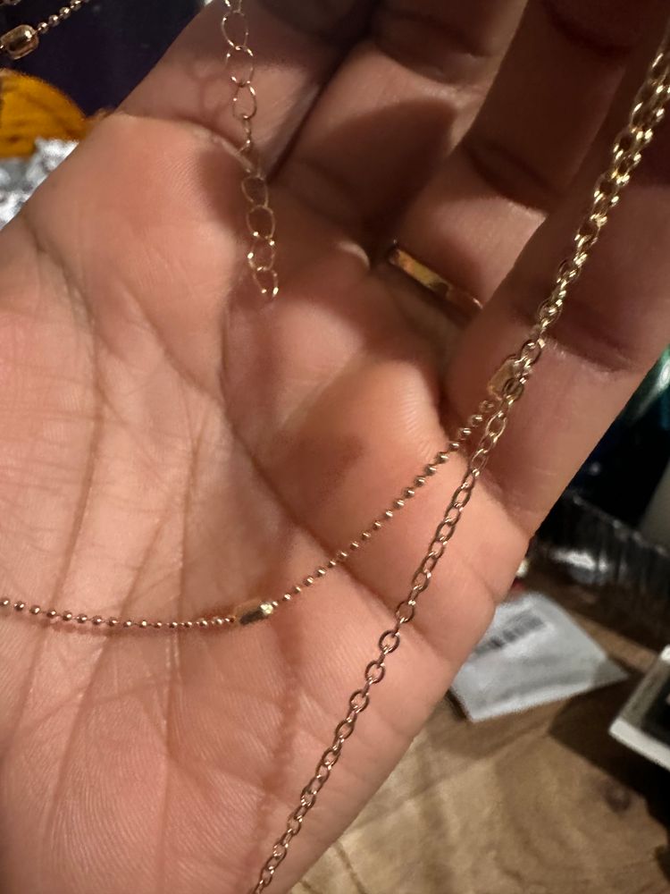 Set Of Gold-Tone Layered Necklaces With Heart, Butterfly, And Pearl Details 4