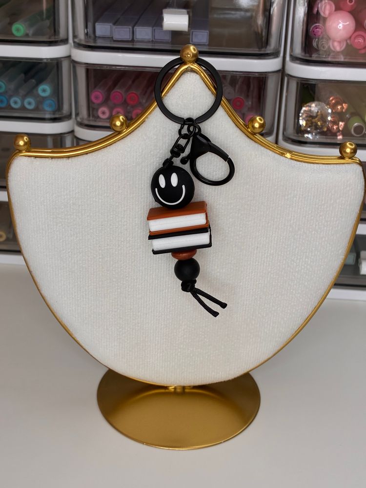 Black Smiley Face Keychain With Stacked Books Charm