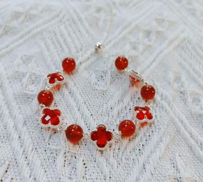 Red Beaded Bracelet With Clover-Shaped Charms
