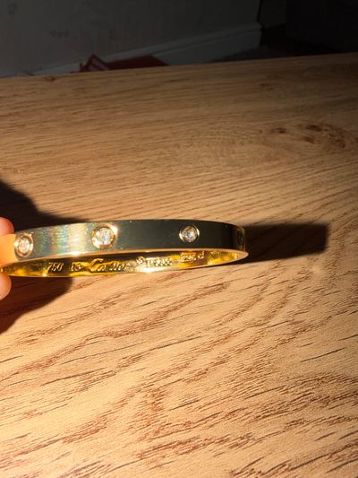 Gold Bangle Bracelet With Embedded Stones
