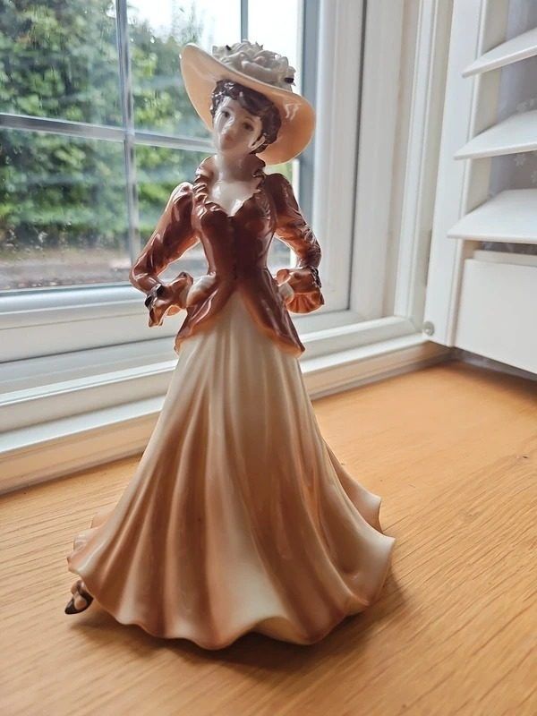 Porcelain Figurine Of A Woman In Vintage Dress And Hat image 1
