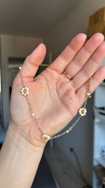 Gold Chain Necklace With White And Orange Flower Charms