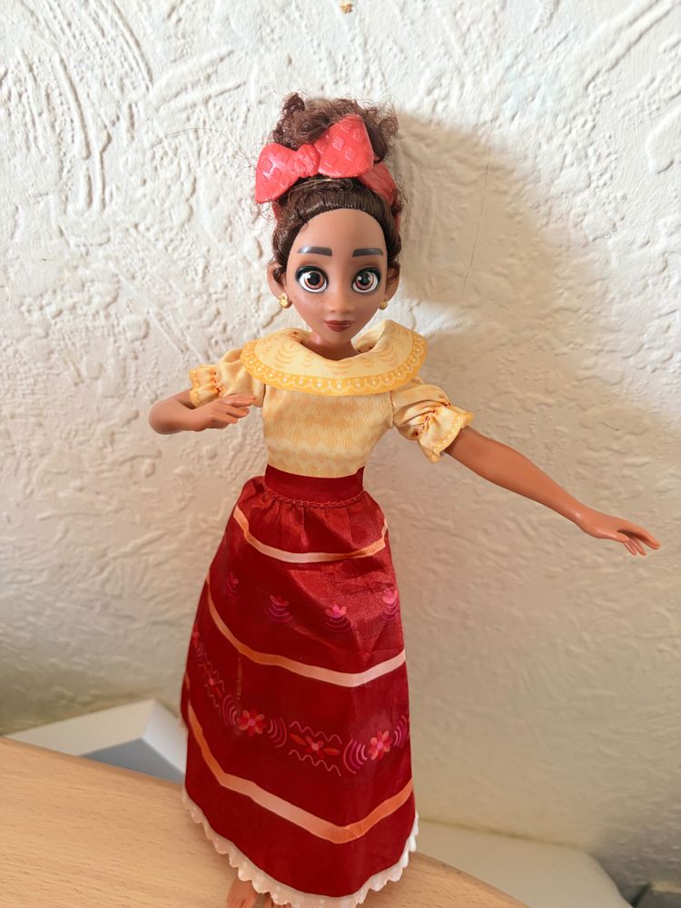 Doll With Yellow Top And Red Skirt
