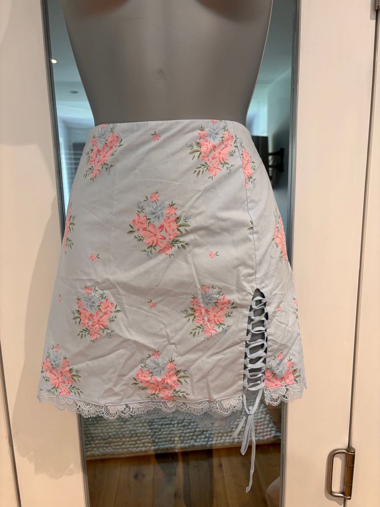 floral mini skirt with tie detail. 
