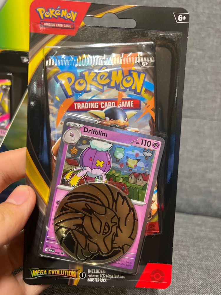Pokémon Trading Card Game Mega Evolution Booster Pack with Drifblim card and coin