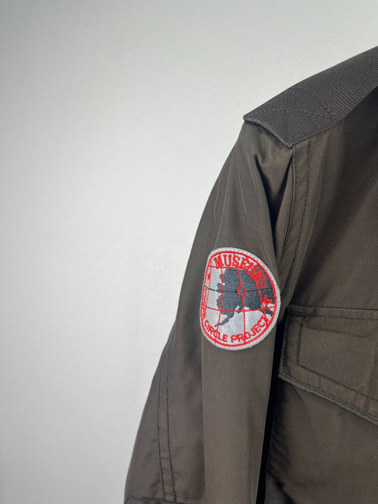 On Running brown jacket with patch on sleeve product image