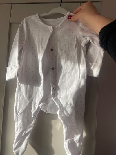 White Baby Onesie With Small Pink Dots