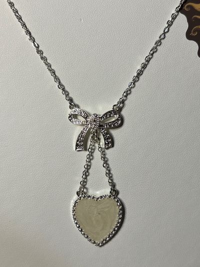 Avon Bow And Heart necklace.