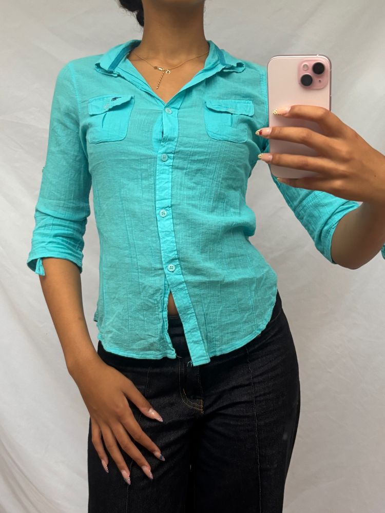 turquoise button-up shirt