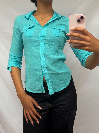 turquoise button-up shirt