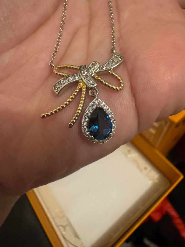 GEM Silver And Gold Bow Pendant Necklace With Blue Teardrop Gem product image