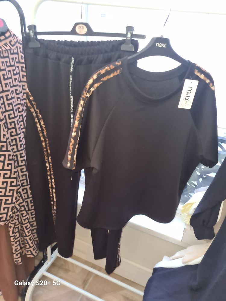 Black Short Sleeve Top And Black Pants With Leopard Print Stripes image 1