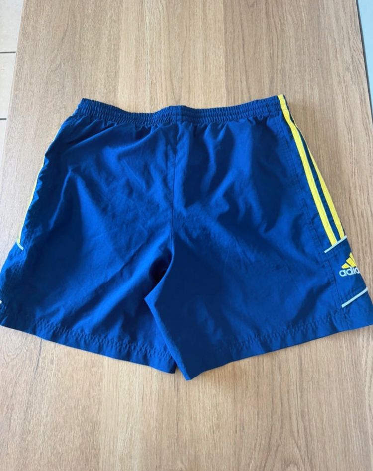 Adidas Blue Shorts With Yellow Stripes image 8